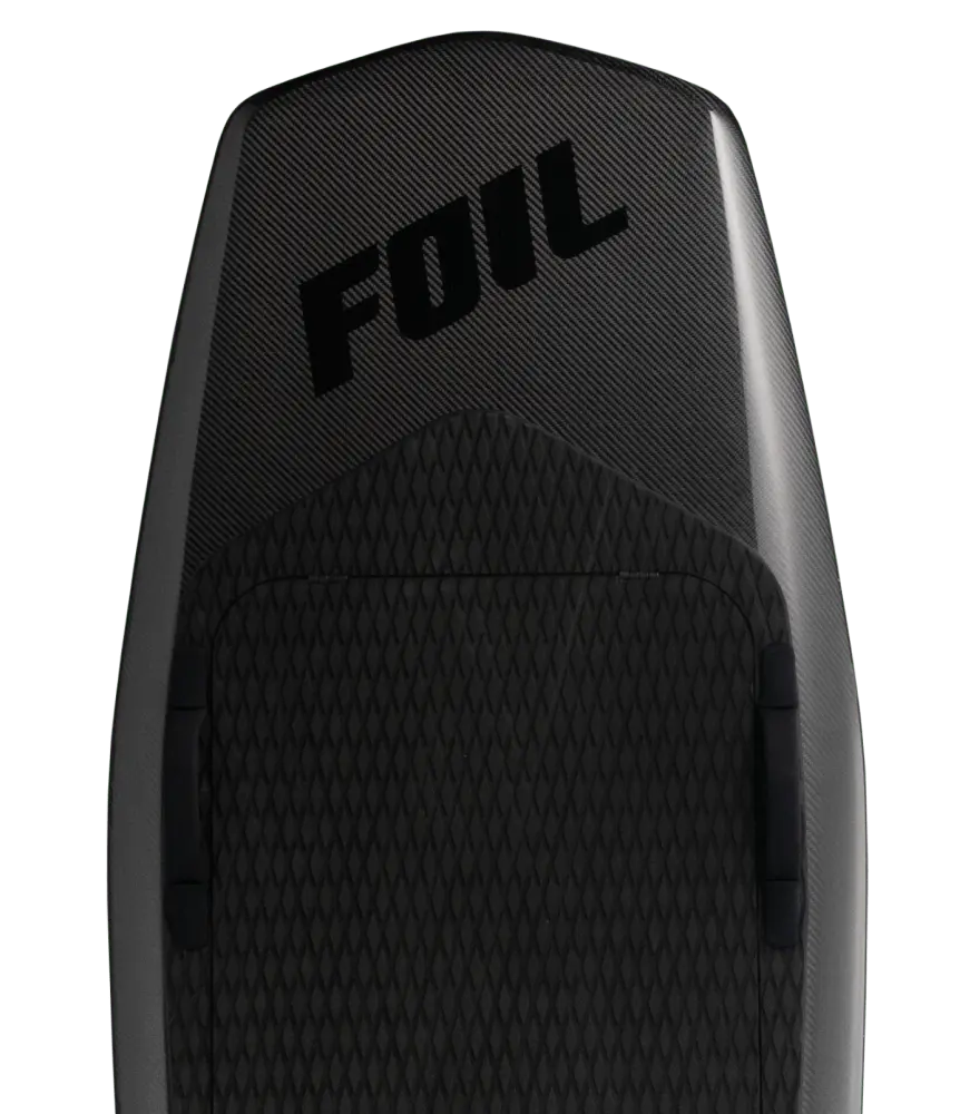 The exposed carbon fiber of the all-new forged deck FOIL R is on full display. The board is pictured on a slate-black background.
